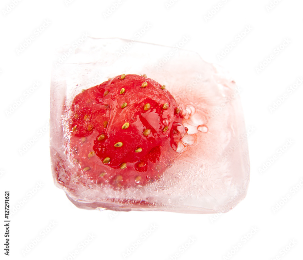frozen in chunks of ice, juicy, fresh red strawberry