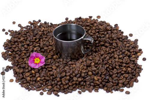 grains of black coffee, inside cup of coffee