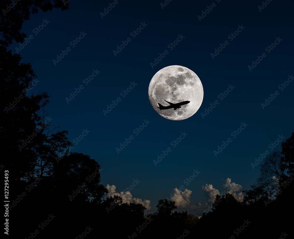 full moon and silhouette plane . full moon and silhouette plane .