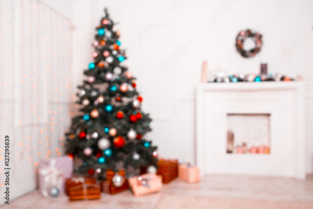 Beautiful new year room with decorated Christmas tree, gifts and fireplace. The idea for postcards. Soft focus. Shallow DOF