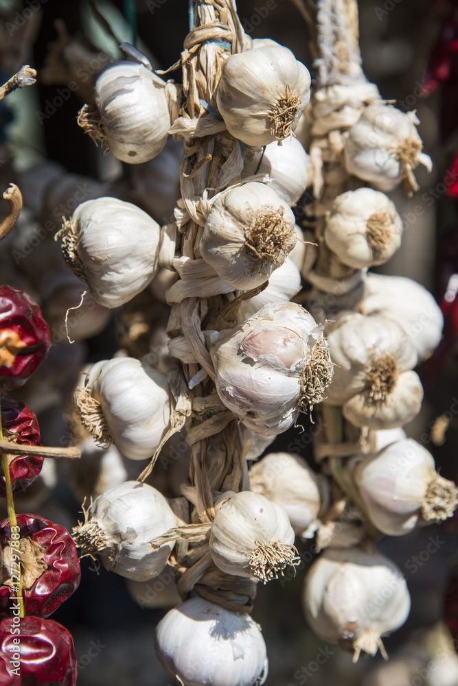 Bunch of garlic hanging on the marketplace Bunch of garlic hanging on the marketplace