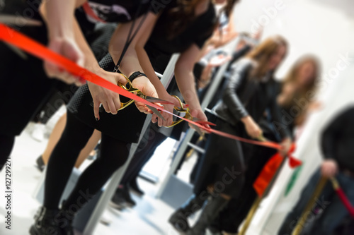 store grand opening - cutting red ribbon photo