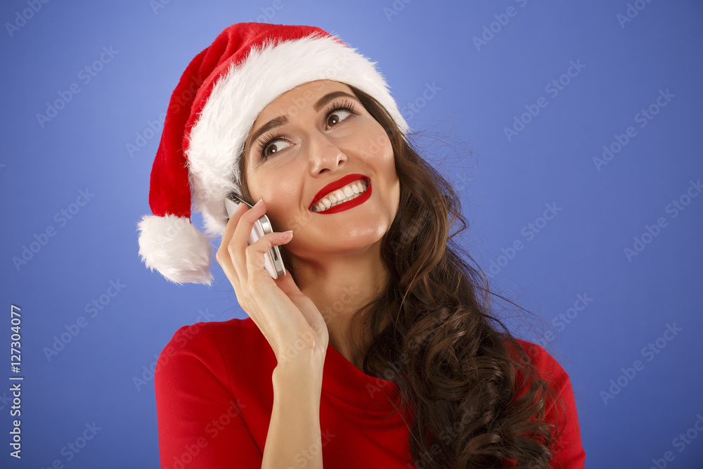 Christmas happy woman with a smart phone Christmas happy woman with a smart phone