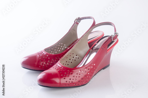 shoe or female red shoes on background.