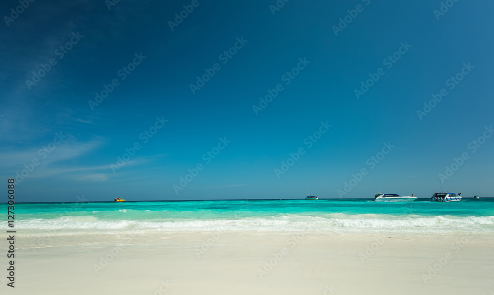 Beautiful gentle wave at the tropical beach with blue sky Beautiful gentle wave at the tropical beach with blue sky