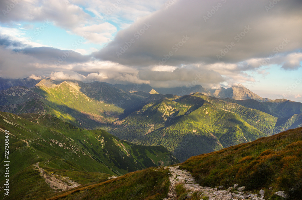 Panorama of amazing summer mountains under the clouds