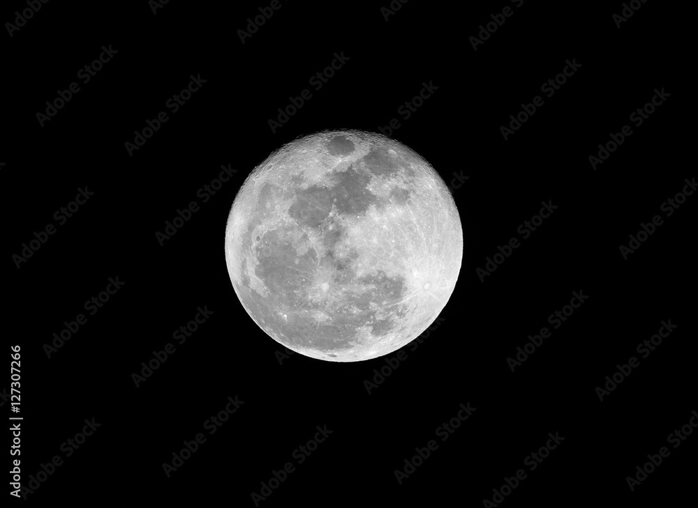 .Full moon over dark black sky on night .Full moon over dark black sky on night