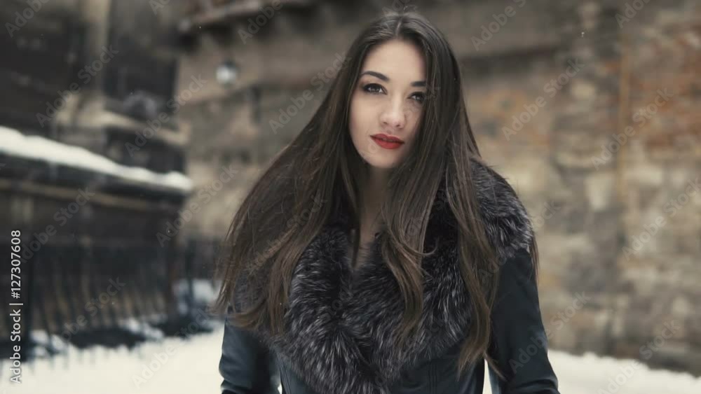 City walking of beautiful brunette girl, having fun in snowy winter time City walking of beautiful brunette girl, having fun in snowy winter time