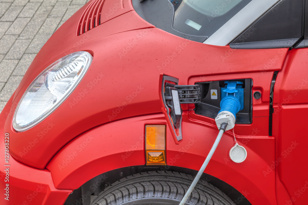 Vehicle with an electric motor, charging, Eco car, HDR Image.