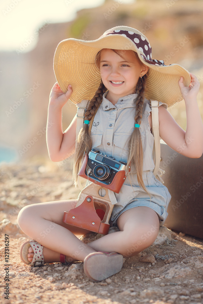 Premium Photo  Little girl in straw hat sitting on the edge of a wooden  dock and fishing in lake at sunset.