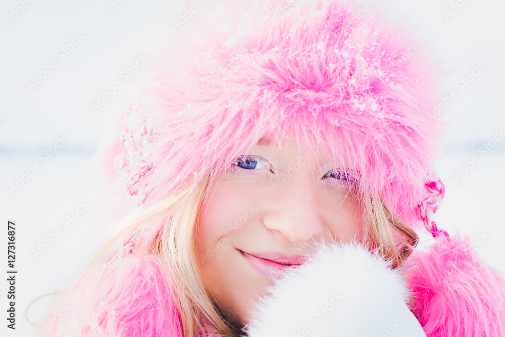 blond girl with pink hat and frozen eyelashes