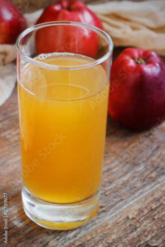 Wallpaper Mural Glass of apple juice and red apples on wooden background Torontodigital.ca