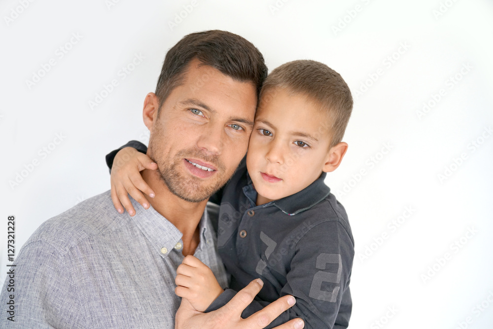 Portrait of man with son in arms, white background isolated Portrait of man with son in arms, white background isolated