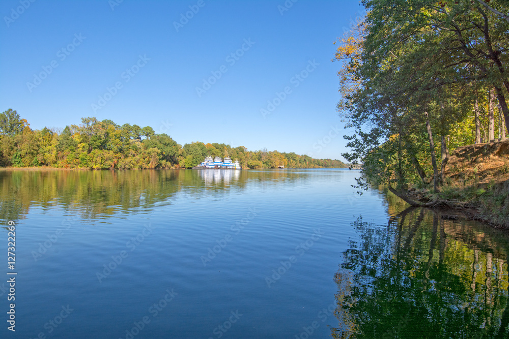 Warrior River with tug boats and fall reflections on the water