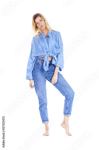Young beautiful blonde woman in blue jeans