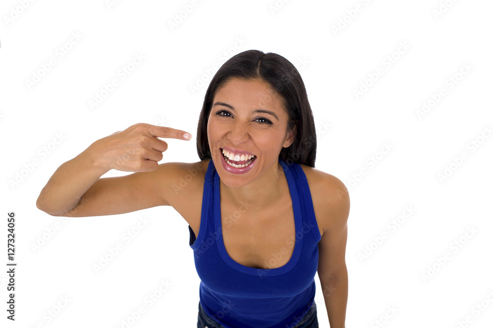 hispanic woman in casual top and jeans smiling happy and cheerful pointing mouth and teeth hispanic woman in casual top and jeans smiling happy and cheerful pointing mouth and teeth
