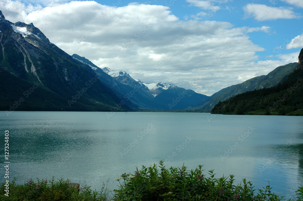 Scenic View of Snowcapped Coastal Mountains Under a Cloudy Sky Near Haines Alaska Scenic View of Snowcapped Coastal Mountains Under a Cloudy Sky Near Haines Alaska