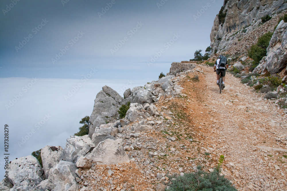 Obraz premium Sardinia between mountains and sea - Riding mountain bike