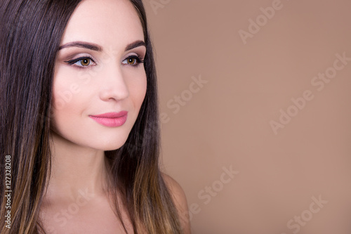 natural beauty concept - portrait of beautiful woman over beige