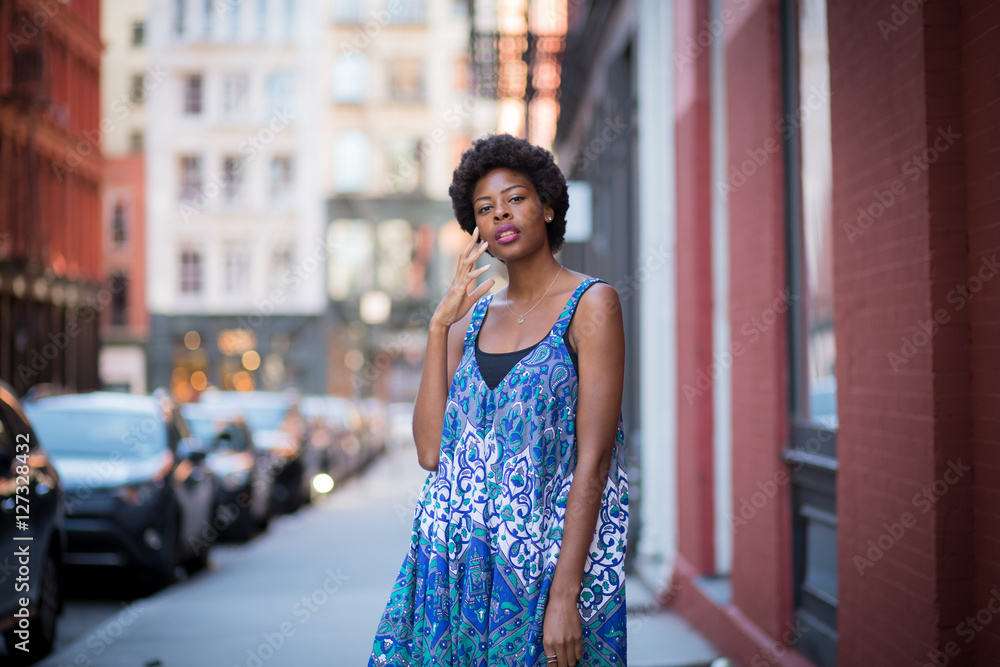 Outdoor portrait of young fashionable African American woman