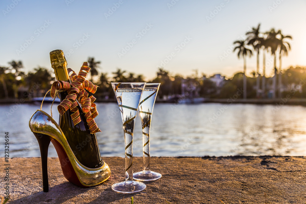 Red and gold bottle holder and champagne glasses/ New Years Eve