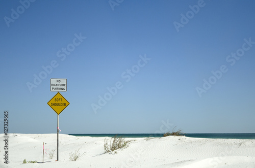 Coastal highway on the Gulf coast Florida USA - October 2016 - Roadside warning signs of soft shoulder and no parking