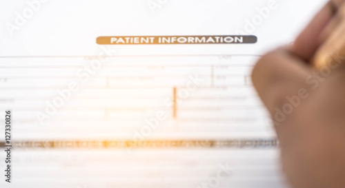 Blur of Patient information form and pen on desk,Medical questio photo
