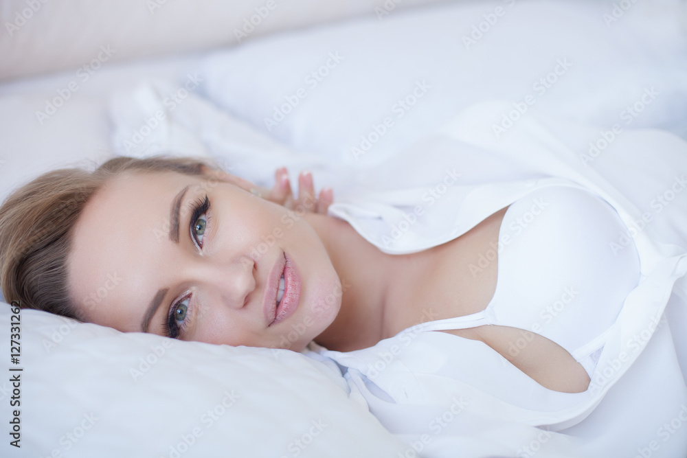 Sensual and beautiful woman in lingerie in the bed