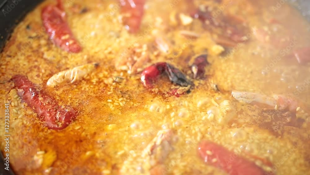 Paella cooking on an electric stove. Typical cuisine of the Valencian Community in Spain Paella cooking on an electric stove. Typical cuisine of the Valencian Community in Spain