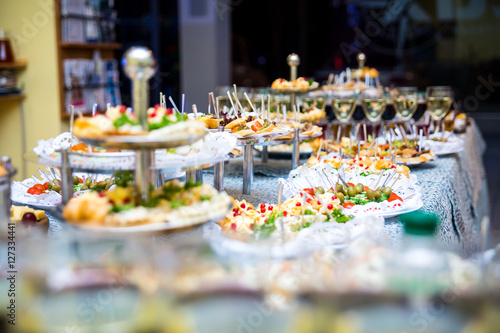 buffet table  Canape  sandwiches  snacks  holiday table  sliced  glasses  celebration  new year  christmas  fourchette  catering  table setting  restaurant