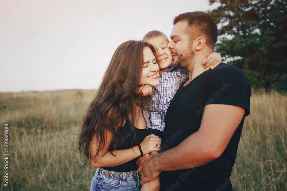 young family with a child have fun outdoors young family with a child have fun outdoors