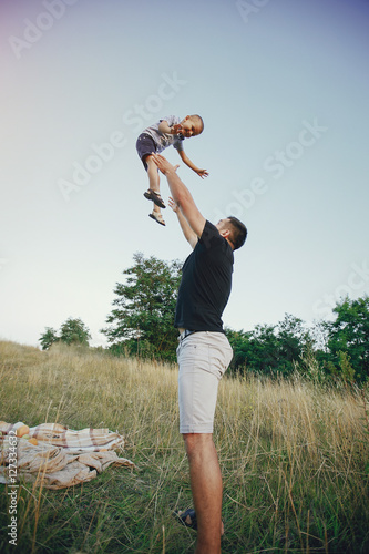Fototapeta Naklejka Na Ścianę i Meble -  young family with a child have fun outdoors