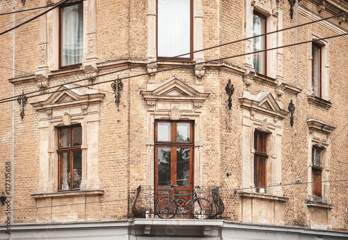 Mountain bike on the balcony of the old Austrian house in Lviv