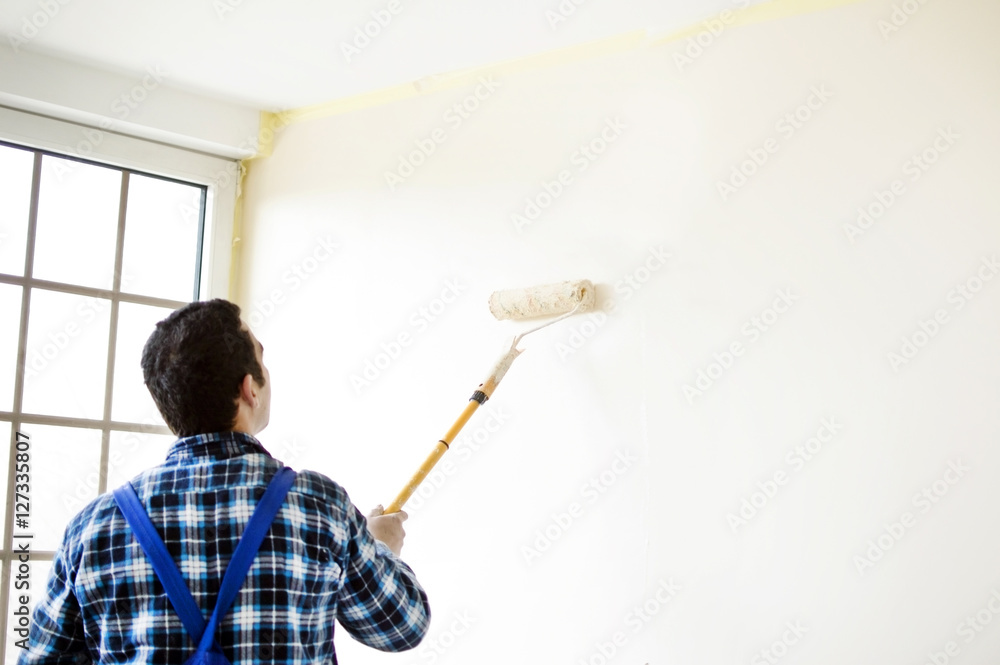 The process of painting the walls in the room The process of painting the walls in the room