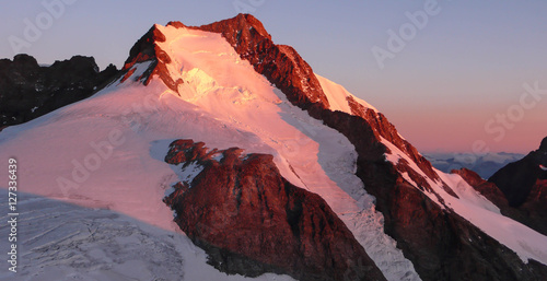 a view of the Swiss Alps with Piz Bernina at sunrise