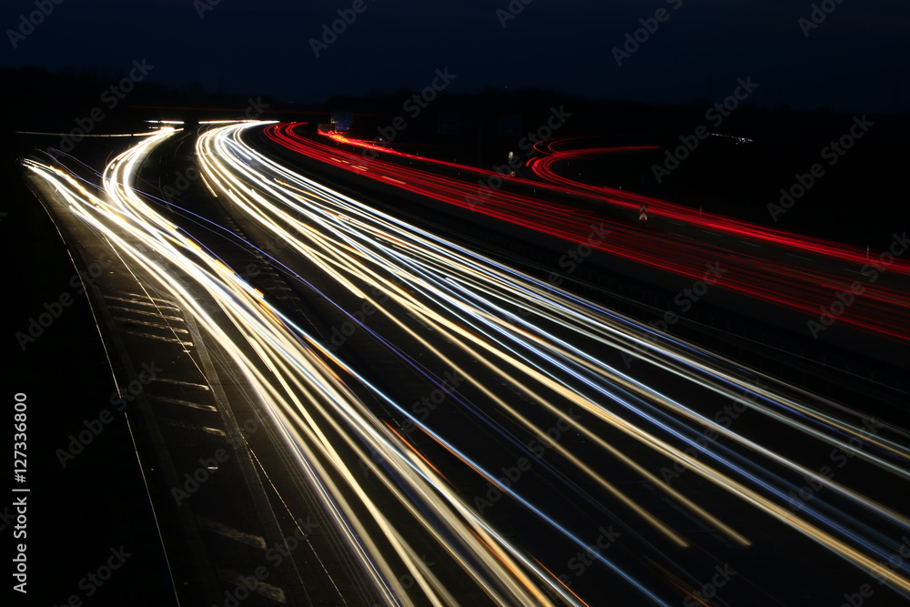 stripes of cars on an highway at night stripes of cars on an highway at night