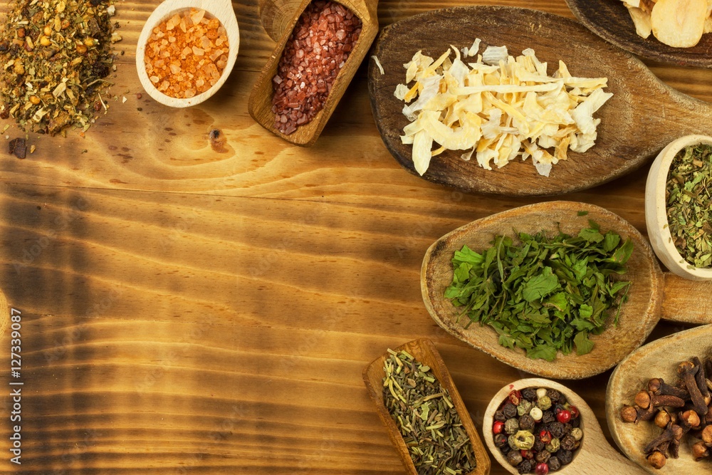 Various kinds of spices on the kitchen table. Seasoning food. Sales of exotic spices. Advertising on spices. Powder spices on spoons in wooden table background.
Various kinds of spices on the kitchen table. Seasoning food. Sales of exotic spices. Advertising on spices. Powder spices on spoons in wooden table background.