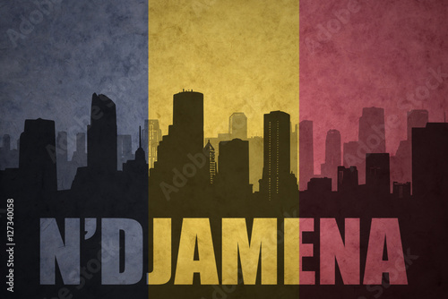 abstract silhouette of the city with text N'Djamena at the vintage chad flag