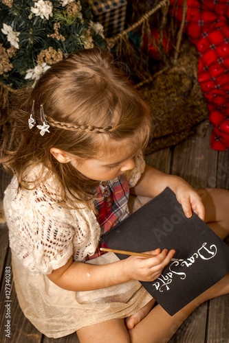Little girl writes letter to Santa