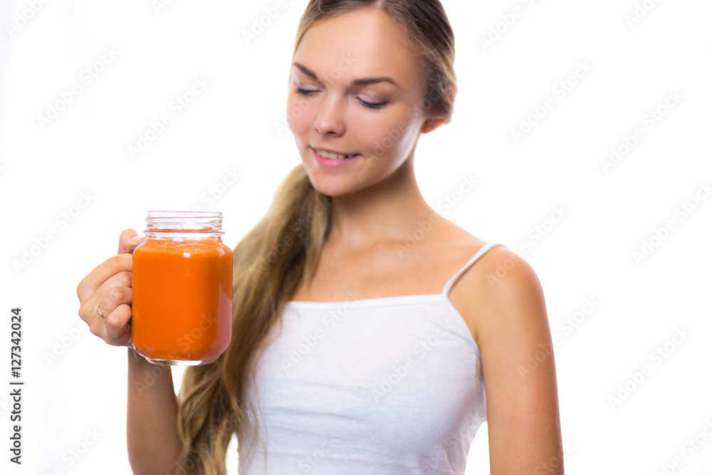 Woman holding a carrot juice diet is a healthy diet smiling helpful Woman holding a carrot juice diet is a healthy diet smiling helpful