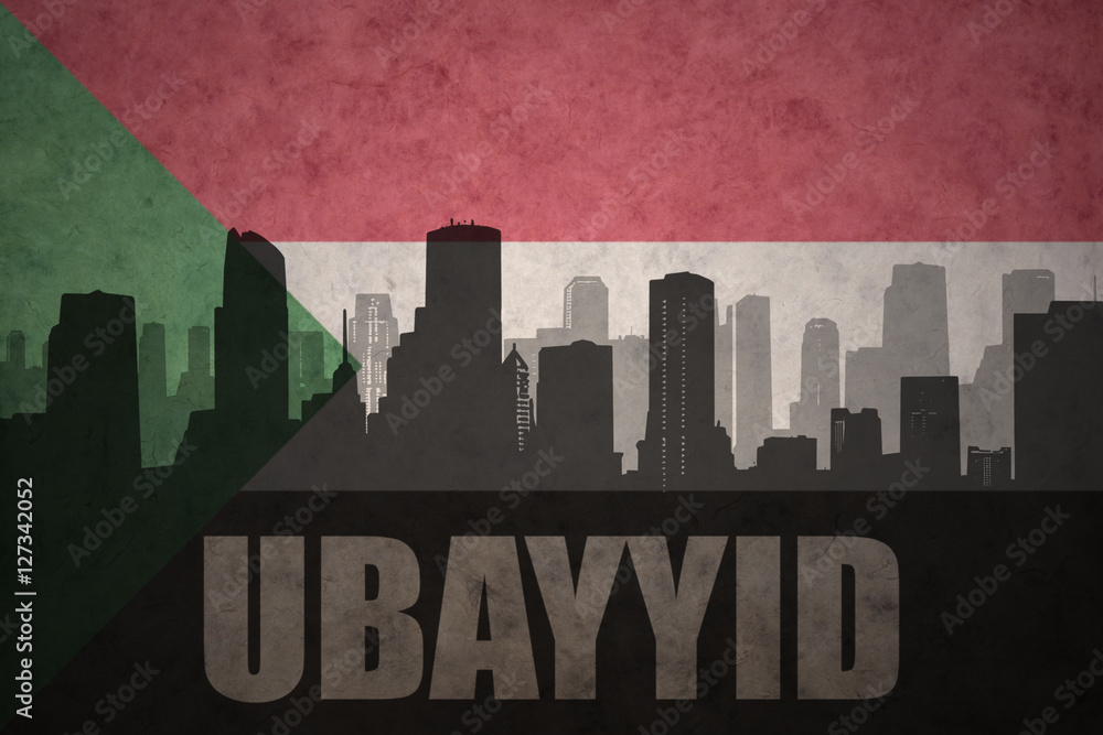 abstract silhouette of the city with text Ubayyid at the vintage sudanese flag
