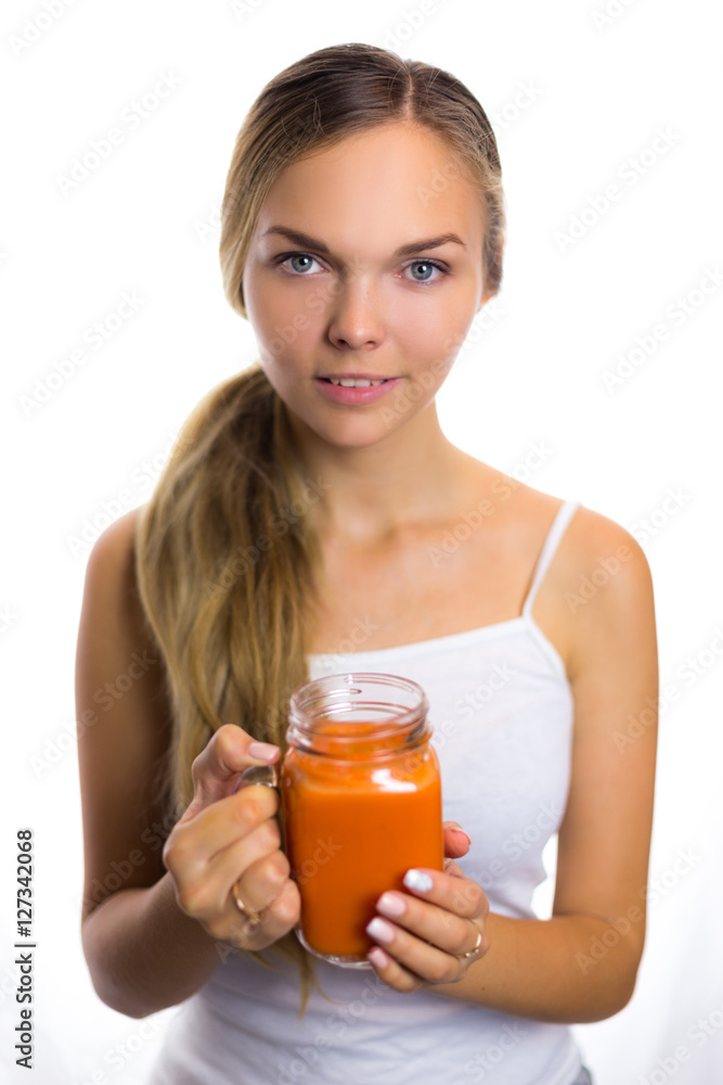 Woman holding a carrot juice diet is a healthy diet smiling helpful Woman holding a carrot juice diet is a healthy diet smiling helpful