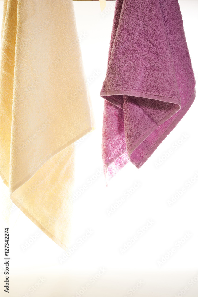 towels hanging on a white background towels hanging on a white background