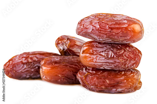sweet dried dates pile stack on white