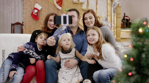 Happy family taking selfie at the christmas party photo
