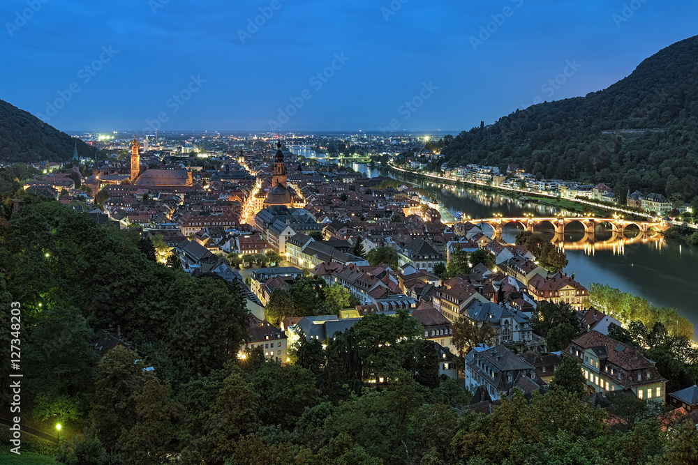 Evening view of Heidelberg, Germany with Jesuit Church, Church of the Holy Spirit and Old Bridge over the Neckar River