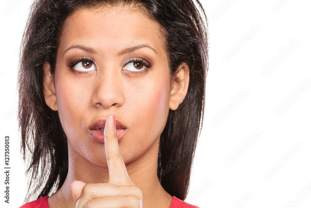 Woman with finger on lips showing silence gesture. Woman with finger on lips showing silence gesture.