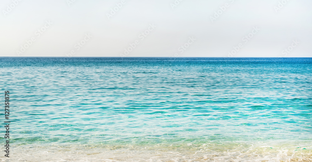 All shades of marine blue. Turquoise clear blue sea water of Mediterranean sea at Cleopatra beach in Alanya, Antalya region, Turkey coast. Gradient of blue at Turkish Riviera