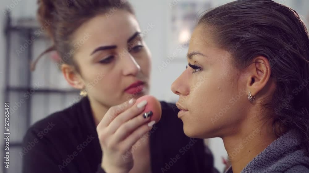 Makeup artist doing models makeup. Makeup artist doing models makeup.
