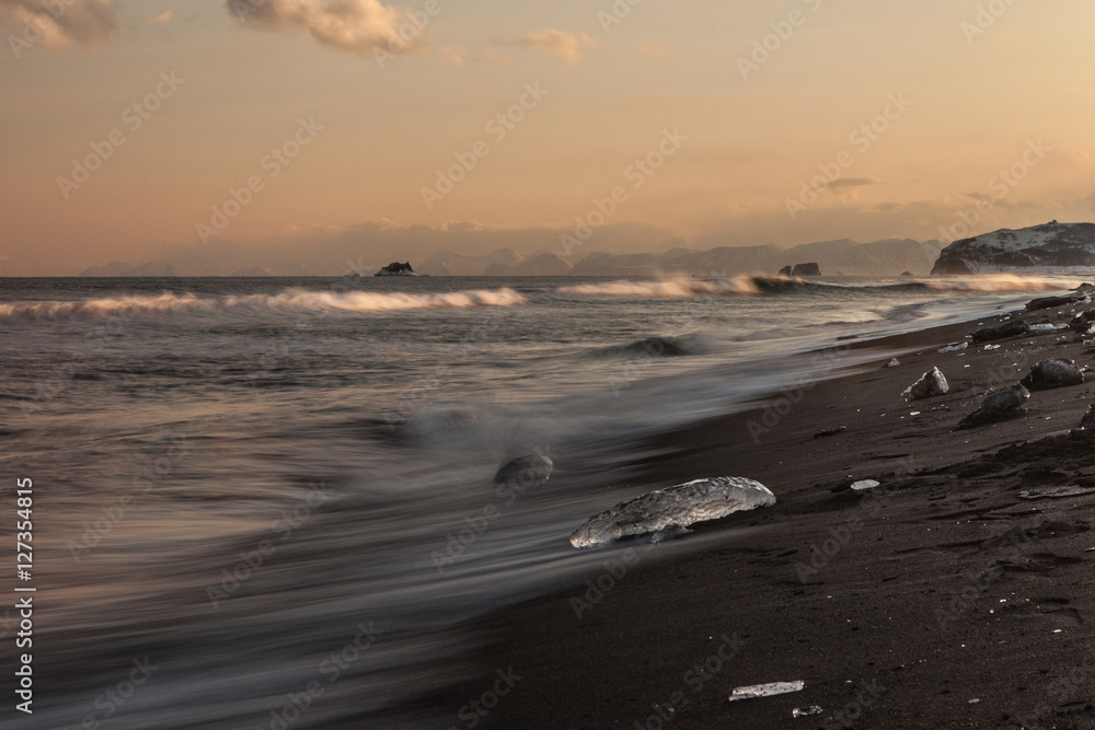Blocks of ice on the beach Halaktyrsky in southeast to Kamchatka.